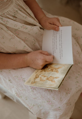 child holding a rugaroo book
