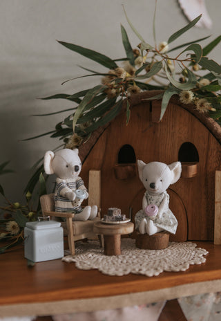 Miniature Rugaroo Koala dolls enjoying pretend play with dollhouse-sized coffee cups — adorable Aussie soft toys for imaginative storytelling.