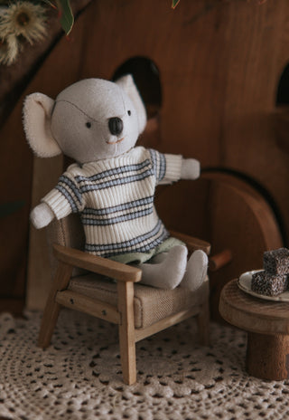 Miniature Rugaroo Koala doll enjoying pretend play with dollhouse-sized plate and lamingtons — adorable Aussie soft toys for imaginative storytelling.