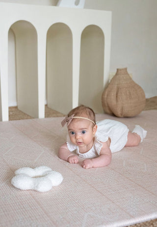 A Neutral and Soft Pink luxe foam padded baby playmat that is double sided, earth-friendly, waterproof and non-toxic.