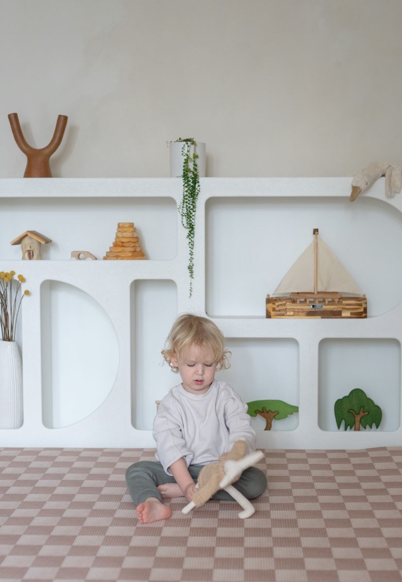 Neutral checkered double-sided foam padded play mat that looks like rug and is waterproof - latte colour