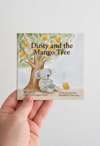 Rugaroos Dusty and the Mango Tree Children's Book Cover held by a hand.