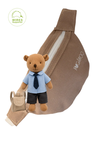 A brown canvas fanny pack with a white zipper, featuring a small plush kindy-prep school blue shirt, navy tie, and dark shorts, along with a tiny beige backpack. The brand name 'RUGAROO' is stamped on the side.
