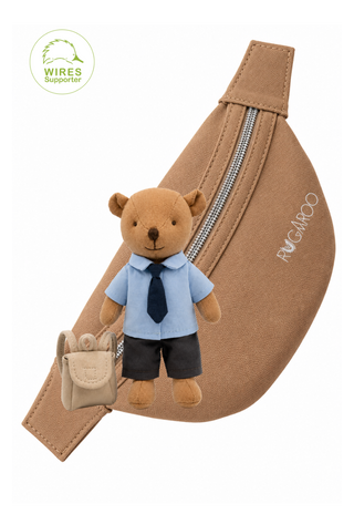 Clancy the Wombat plush doll in a blue school shirt, navy tie and charcoal shorts, with a mini backpack and tan canvas Rugaroo pouch bag