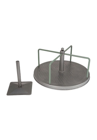 Metal miniature playground equipment with a round platform and a pole on a white background