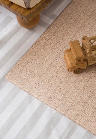 double sided baby foam padded play mat that looks like a woven knotted rug in neutral colour