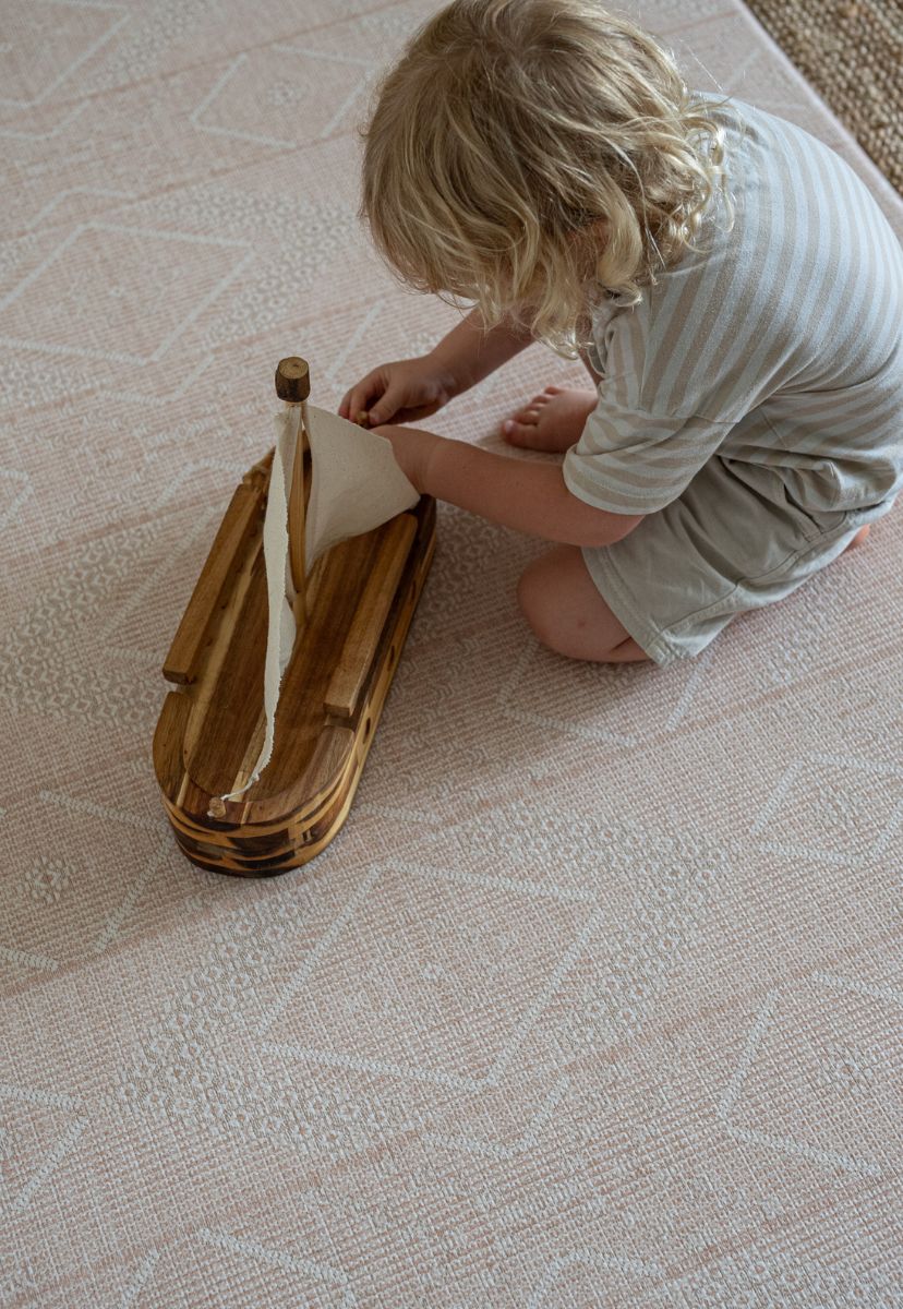 A Neutral and Soft Pink luxe foam padded baby playmat that is double sided, earth-friendly, waterproof and non-toxic.