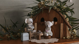 Miniature Rugaroo Koala dolls enjoying pretend play with dollhouse-sized coffee cups — adorable Aussie soft toys for imaginative storytelling.