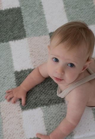 Baby crawling on Rugabub green checkered non toxic foam baby play mat.