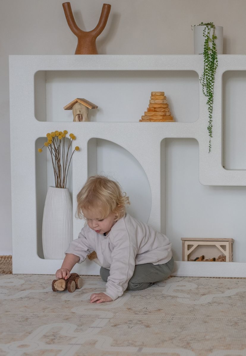 neutral play mat with car tracks and train tracks