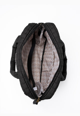 Shadow Moss nappy bag showing multiple pockets and organised interior for parents.
