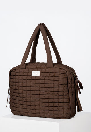 Colour-block baby bag in Clay Dusk with modern panels and premium recycled nylon finish.