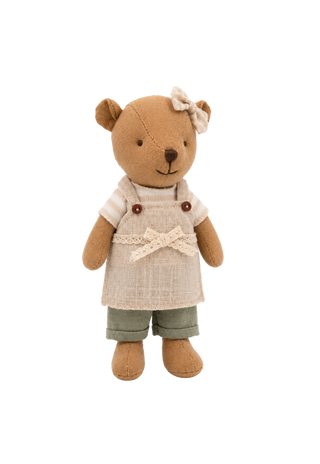 A small plush rugaroo wombat doll with a warm tan-brown body, wearing a cream-colored apron over a striped shirt, olive green pants, and a cream bow on its head, isolated on a white background.