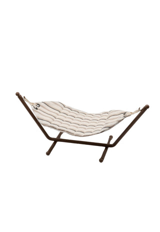 Textured miniature dollhouse hammock on a stand with wavy pattern on a white background
