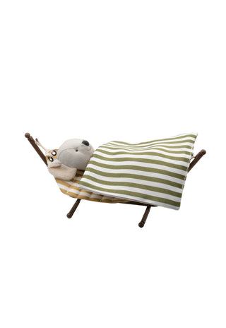 miniature dollhouse hammock with wavy pattern on a stand with a miniature koala doll covered in a blanket