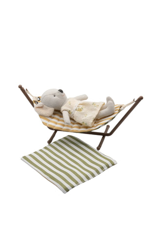 miniature dollhouse hammock with wavy pattern on a stand against a white background