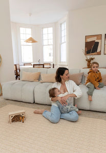 foam padded play mat that looks like a woven knotted rug in neutral colour