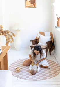 round checkered latte and brown foam padded play mat
