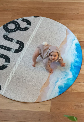 round baby play mat with ocean and road