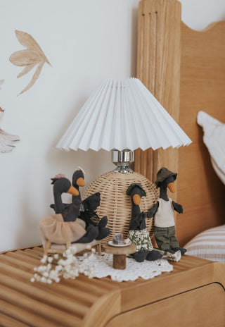 The full Rugaroo Black Swan flock gathered around a miniature table with lamingtons and fairy bread - collectible Australian heirloom plush dolls for nursery display