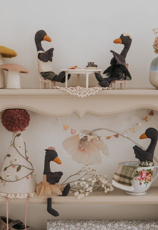 Full Rugaroo Black Swan collection — Reed, Wattle, Byron and Maali styled across a vintage nursery shelf with miniature furniture, tea cups and bunting - Australian heirloom collectible plush dolls