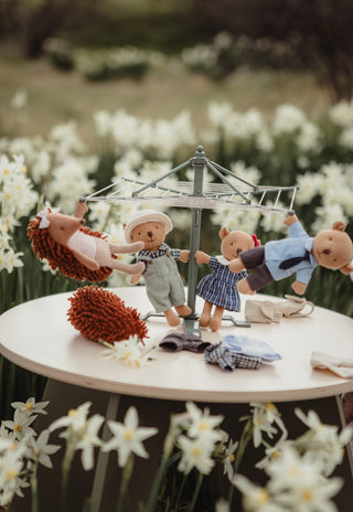 Rugaroo echidna and wombat dolls hanging off a miniature Australian clothesline hoist