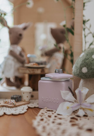 A miniature Rugaroo Kangaroo doll holding a tiny esky filled with fairy bread, adding a touch of Aussie charm to playtime