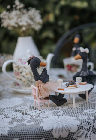 Wattle and Maali Rugaroo black swan plush dolls enjoying a miniature tea party with lamingtons and fairy bread — collectible Australian heirloom toys for imaginative play